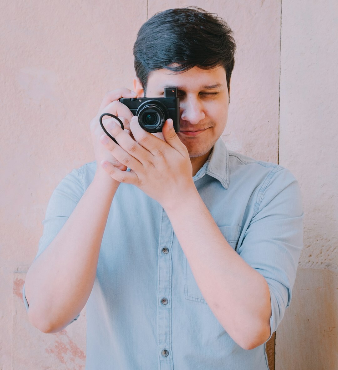 Belgian male camera operator holding a video camera